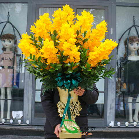 Yellow cymbidium orchid arrangement