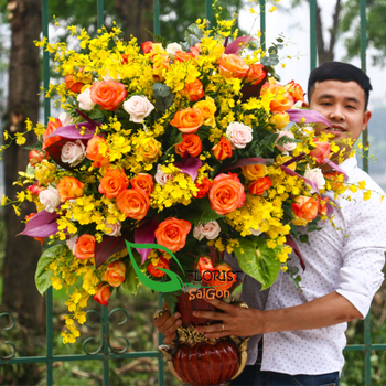 Send Cheerful yellow flower arrangement to Hochiminh city
