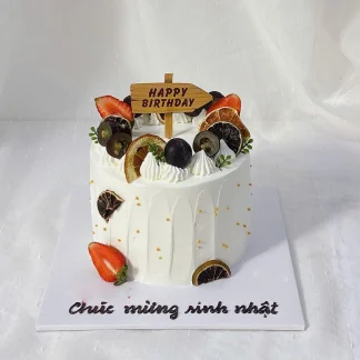 fresh fruit birthday cake with strawberries and blueberries in Saigon
