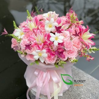 Birthday bouquet with lilies roses tulips and snapdragons