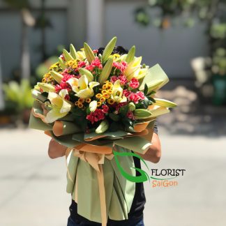 Bouquet of yellow lilies and pink carnations