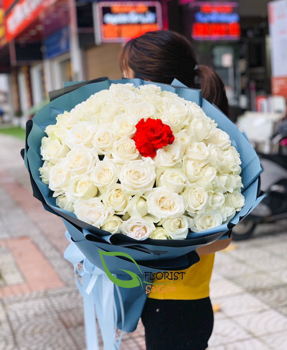 Bouquet of white roses and one red roses for Valentines day