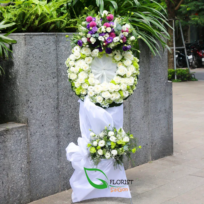 White condolence flower wreath for a funeral service