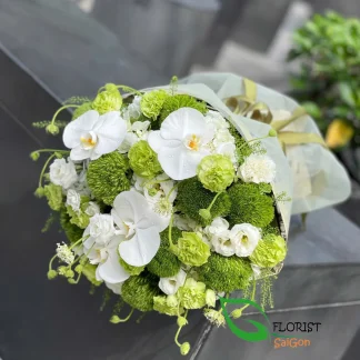 White and green flower bouquet with white orchids in Saigon