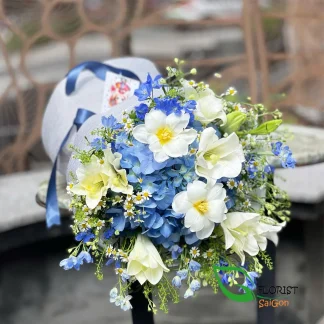 Blue and white flower bouquet with hydrangeas and white lilies in Saigon